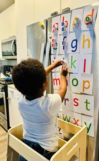 Boy using Attractivia Magnetic Big Alphabet ABC Flash Cards